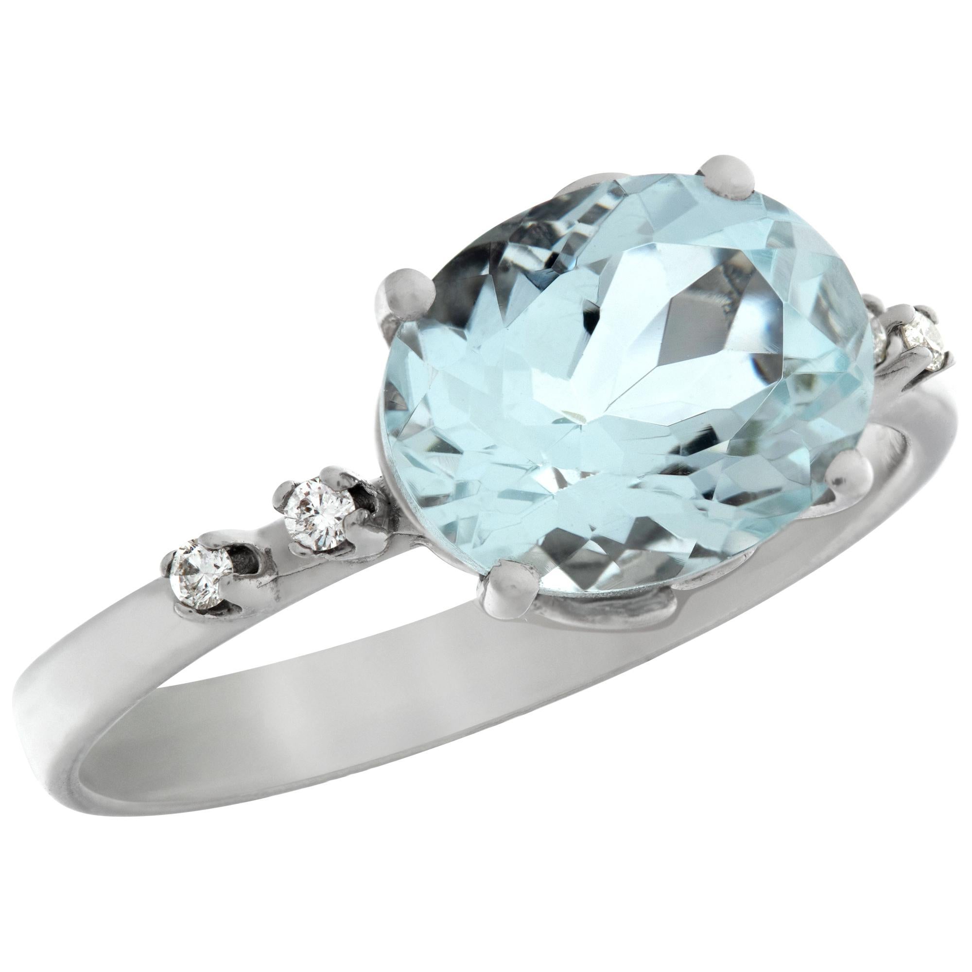 Beautiful 1.90 carat oval cut Aquamarine in an 18k white gold setting with 0.04 carat in diamonds accents. Size 7.75.This aquamarine ring is currently size 7.75 and some items can be sized up or down, please ask! It weighs 2.2 pennyweights and is