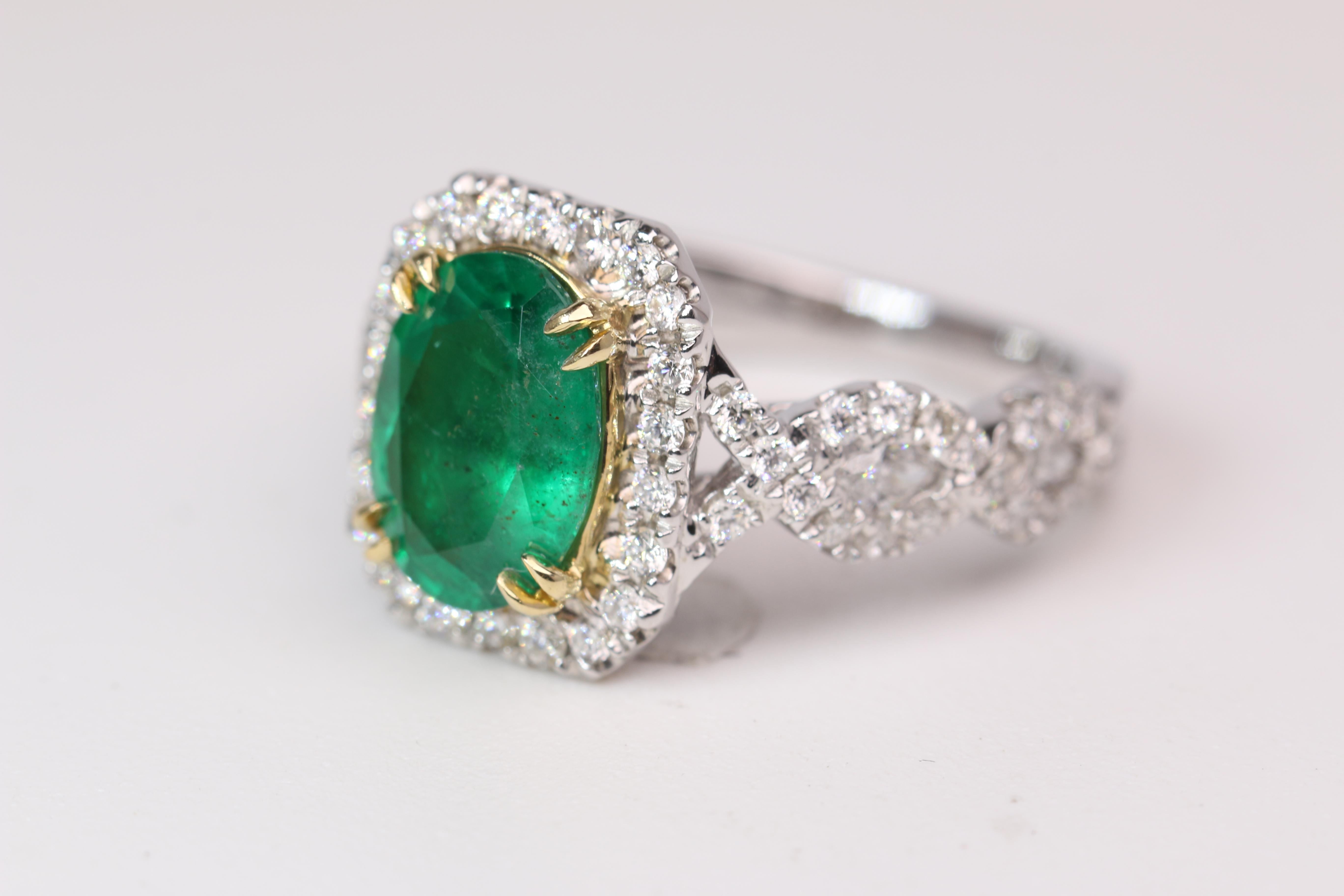 This stunning ring features a 1.85ct oval cut Emerald with 1.0CTW of diamonds. The ring weighs 5.7g and is sized to a 6.5. Marked 14kwg. The oval measures 10mm X 7.3mm and features 4 marquis diamonds and 60 round cut diamonds.