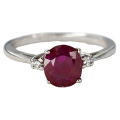White Gold Oval Ruby Three-Stone Solitaire Ring
