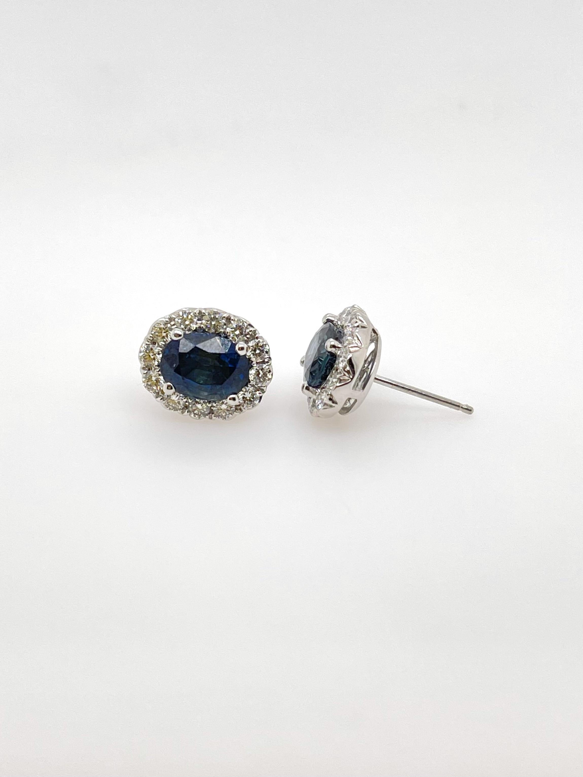 White Gold Oval Sapphire & Diamond Stud Earrings
18kt white gold 
2 blue sapphires= 3.73ct 
24 round brilliant diamonds= 0.81ct 
