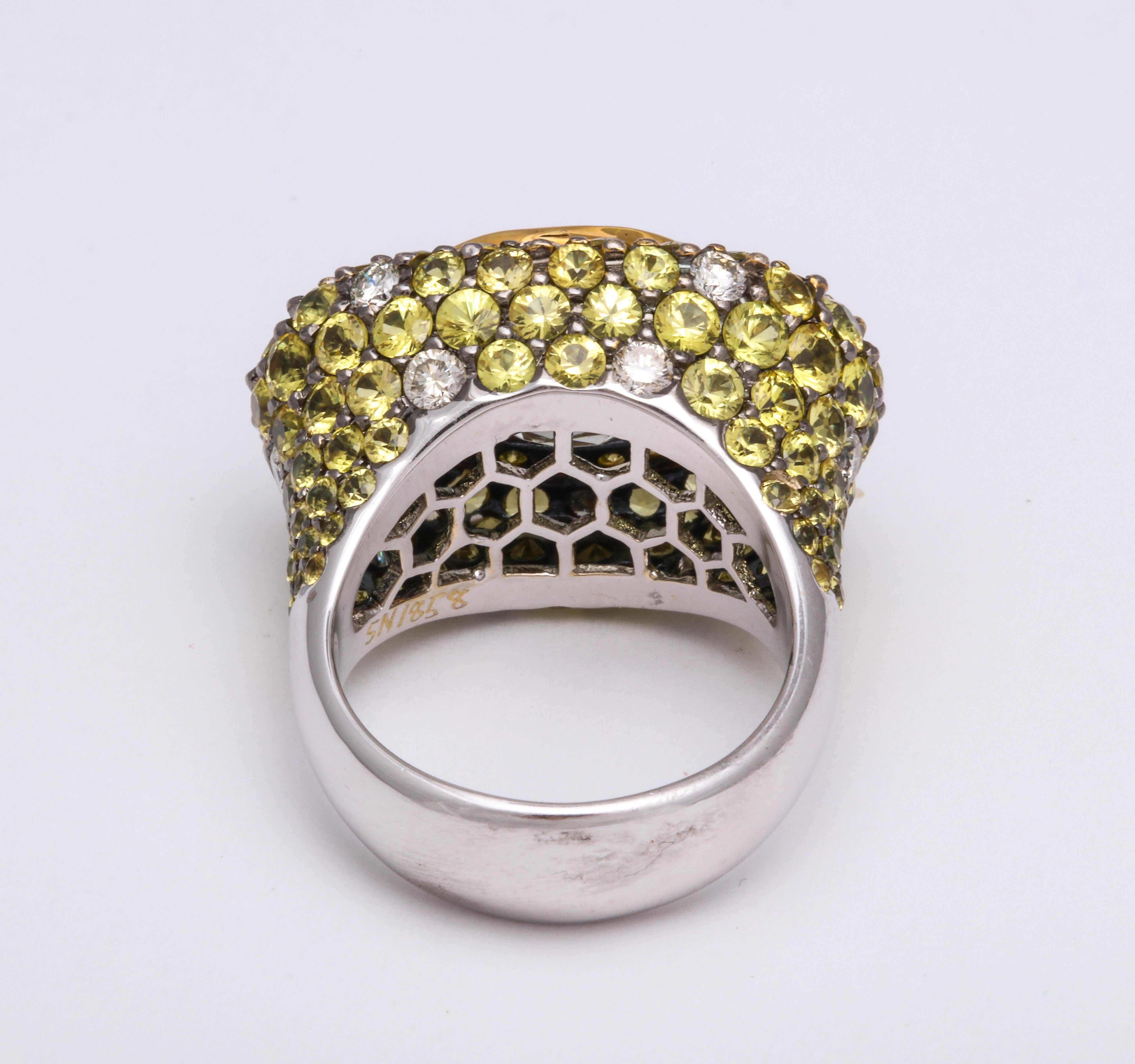 Contemporary White Gold, Oval Yellow Sapphire, Pave-Set Sapphire and Diamond Cocktail Ring For Sale