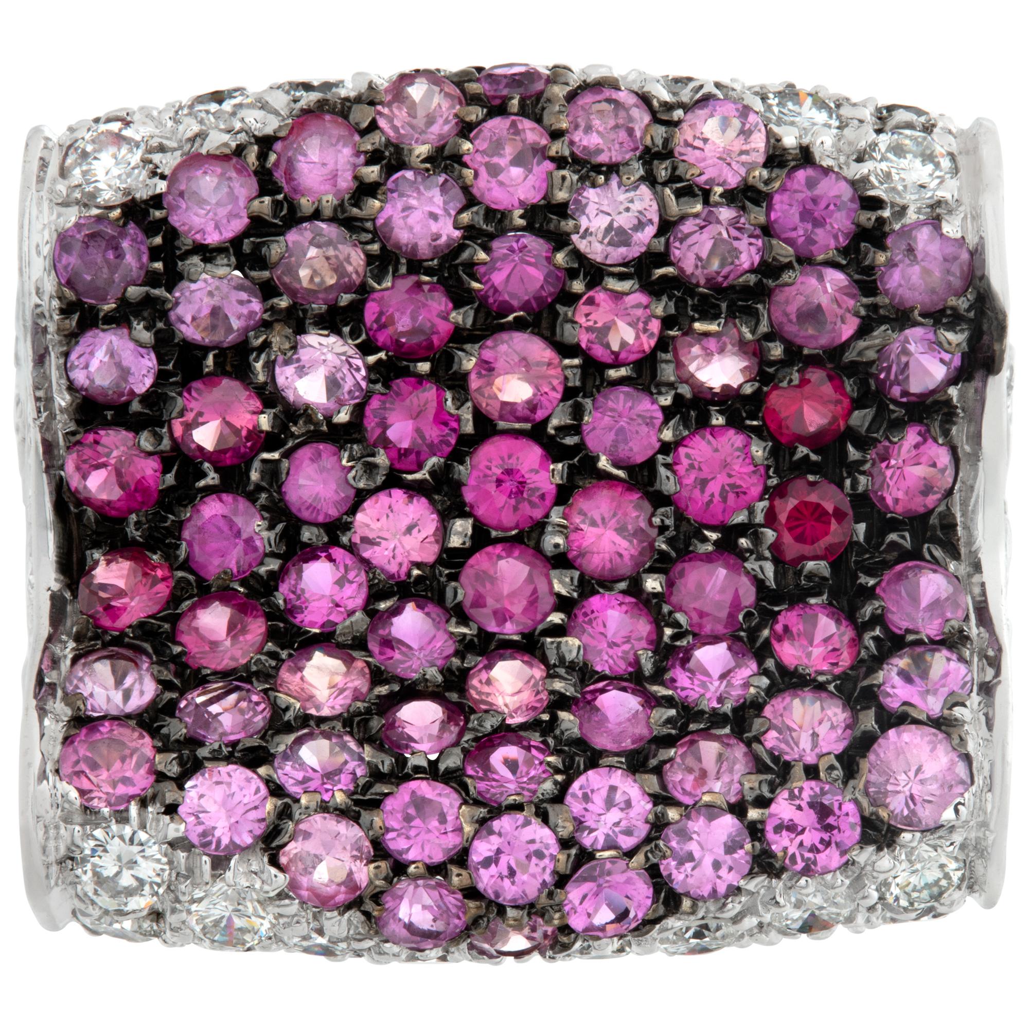 Glamorous 18k white gold pave ring with approximately 2 carats in round brilliant cut diamonds and approximately 2 carats in brilliant cut pink sapphires. Size 5.5, head 20mm wide 18mm long, shank 5mm.This Diamond/Sapphires ring is currently size
