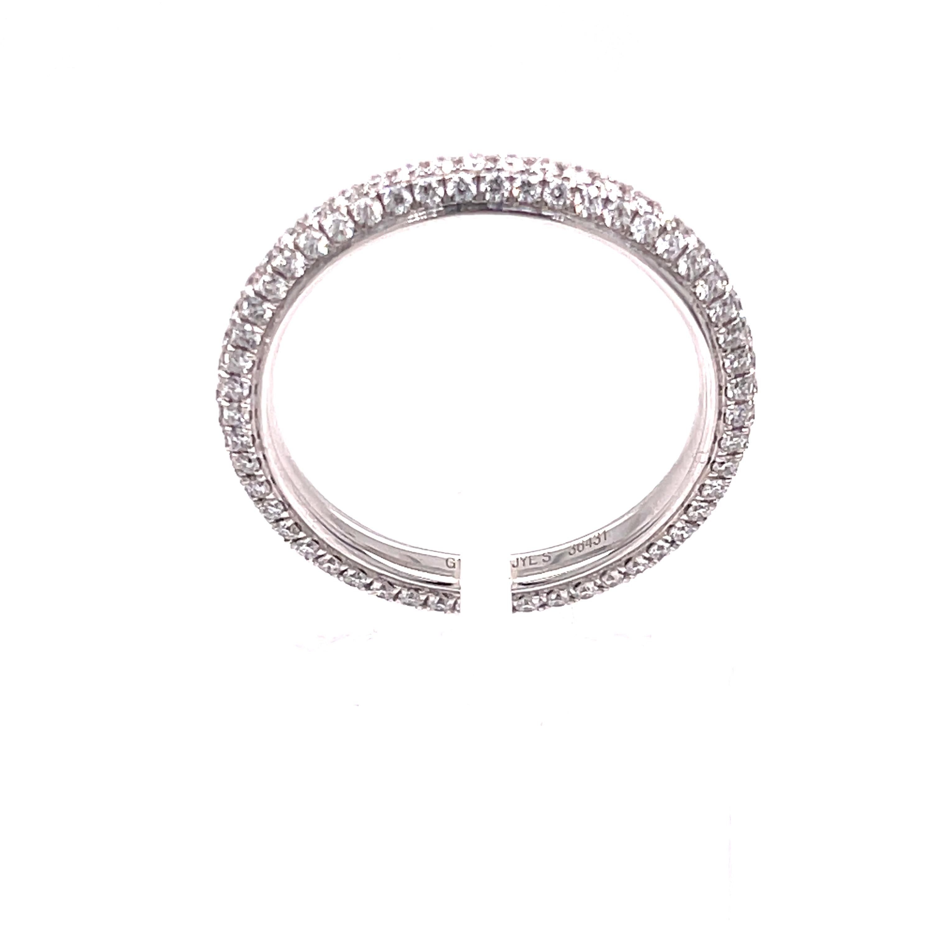 Diamond eternity band in 18K white gold. The band features 0.79ctw of pave set diamonds. The ring is size 6. 