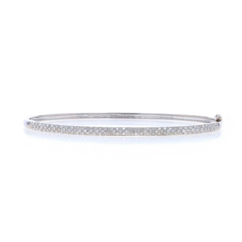 Metal Content: 14k White Gold

Stone Information
Natural Diamonds
Carat(s): 1.00ctw
Cut: Single
Color: H - I
Clarity: I1 - I2

Total Carats: 1.00ctw

Style: Oval Bangle
Fastening Type: Tab Box Clasp with One Side Safety Clasp
Features: Pavé Set