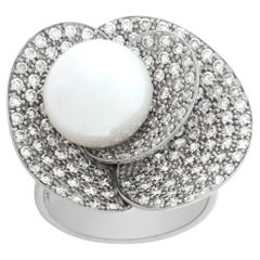 Vintage White gold pave diamond petals ring cradling a 11.3 mm cultured pearl