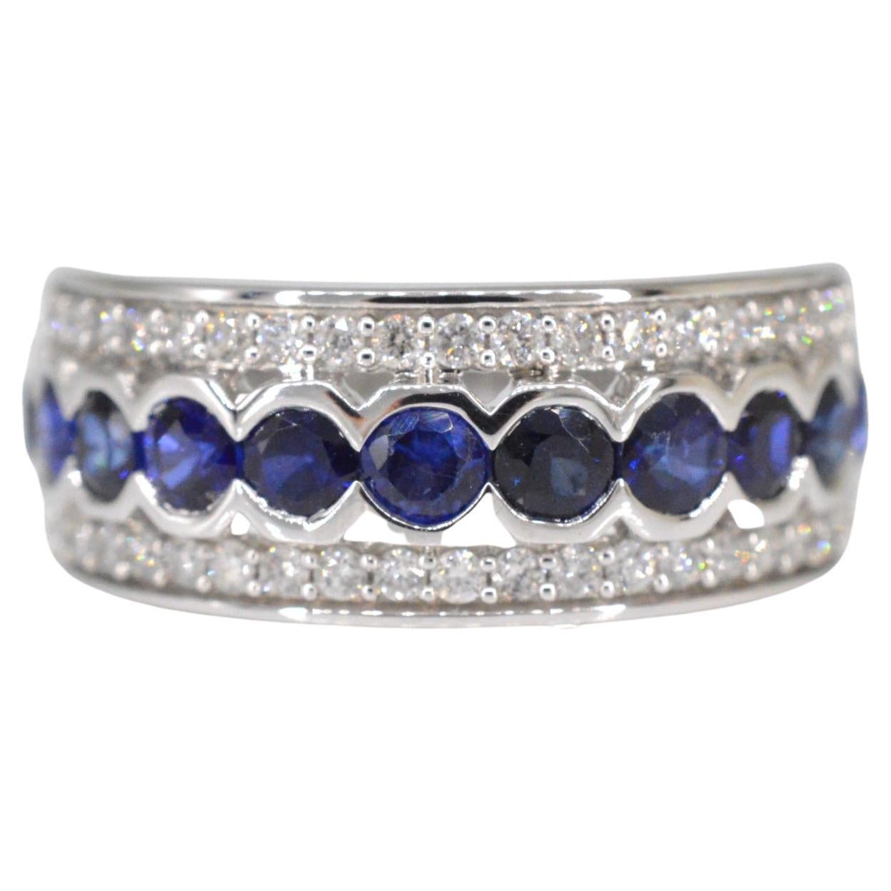 White gold pave ring with diamonds and sapphire