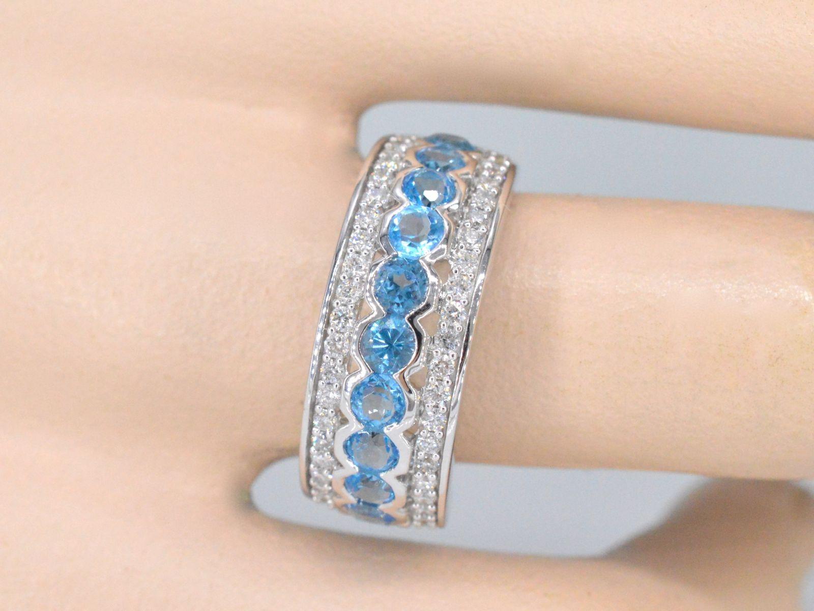 Diamonds

Weight: 0.50 carat

Cut: Brilliant cut

Colour: F-G

Clarity: SI-P

Quality: Very good

Gemstone: Topaz

Cut: Round cut

Colour: Swiss Blue

Weight: 1.50 carats

Jewel: Ring

Weight: 5.5 gram

Hallmark: 14 karat 

Ring size: 54 (17.25