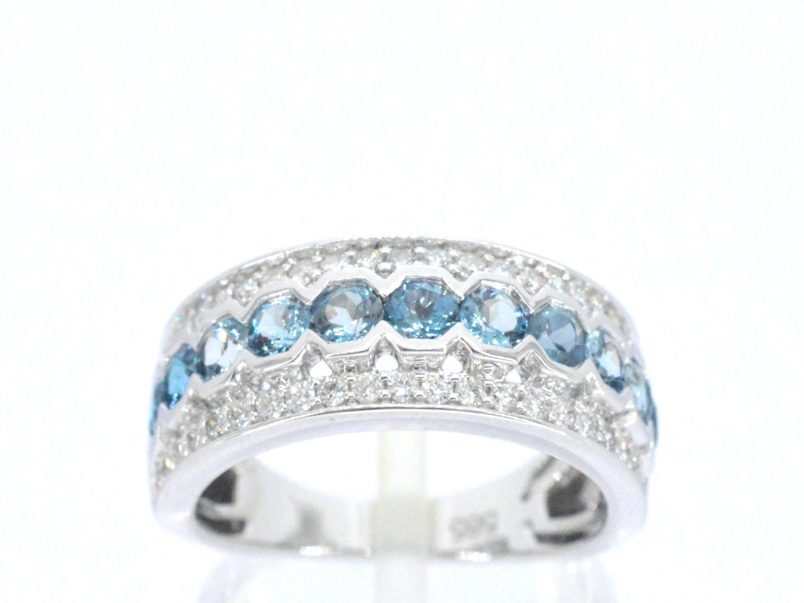 This stunning white gold pave ring features a dazzling combination of diamonds and topaz gemstones. The diamonds are carefully pave-set along the band, creating a continuous and sparkling display, while the topaz gemstones add a touch of color and