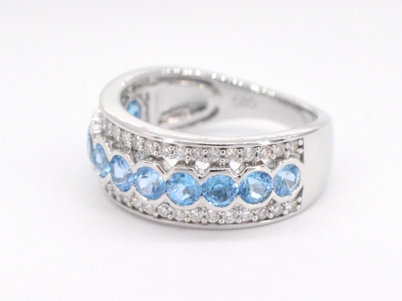 Contemporary White gold pave ring with diamonds and topaz
