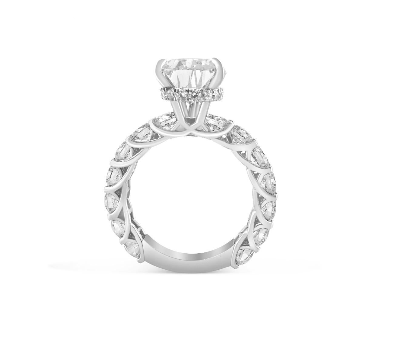 WHITE GOLD PEAR CUT DIAMOND RING WITH SIDE STONES - 6.65 CT


Set in 18K White gold


Total pear cut diamond weight: 3.66 ct
[ 1 diamond ]
Color: G
Clarity: VVS2

Total round white diamond weight: 2.69 ct
[ 14 diamonds ]
Color: G
Clarity: VS

Total