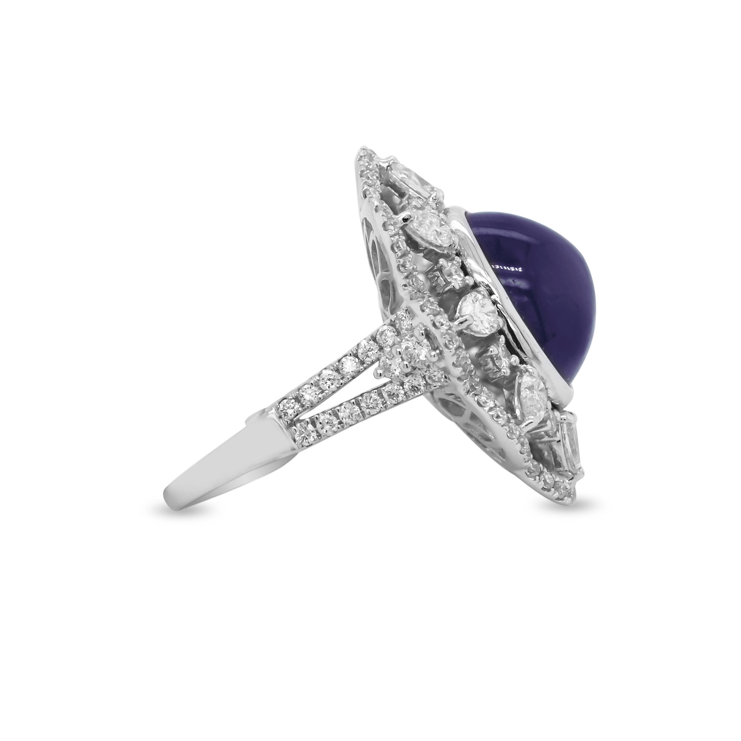 Contemporary White Gold Pear Shape and Round Diamond Ring with Cabochon Blue Sapphire Center For Sale