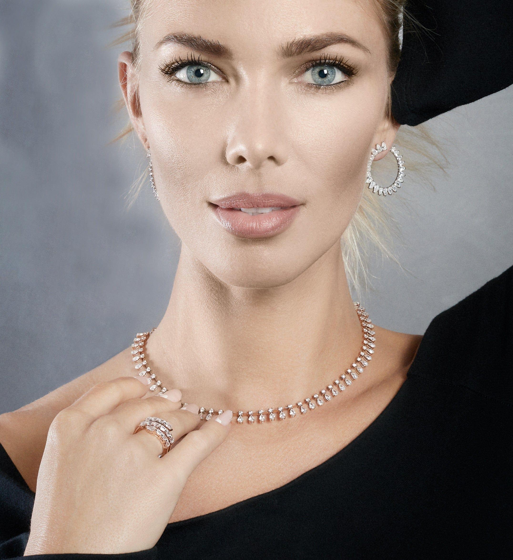 She'll be sure to stand-out in these eye-catching hoop earrings. Designed with pear-shaped diamonds creating a sunburst effect, these diamond hoop earrings are crafted from 18k white gold. Diamond hoops are a perfect staple piece for everyday