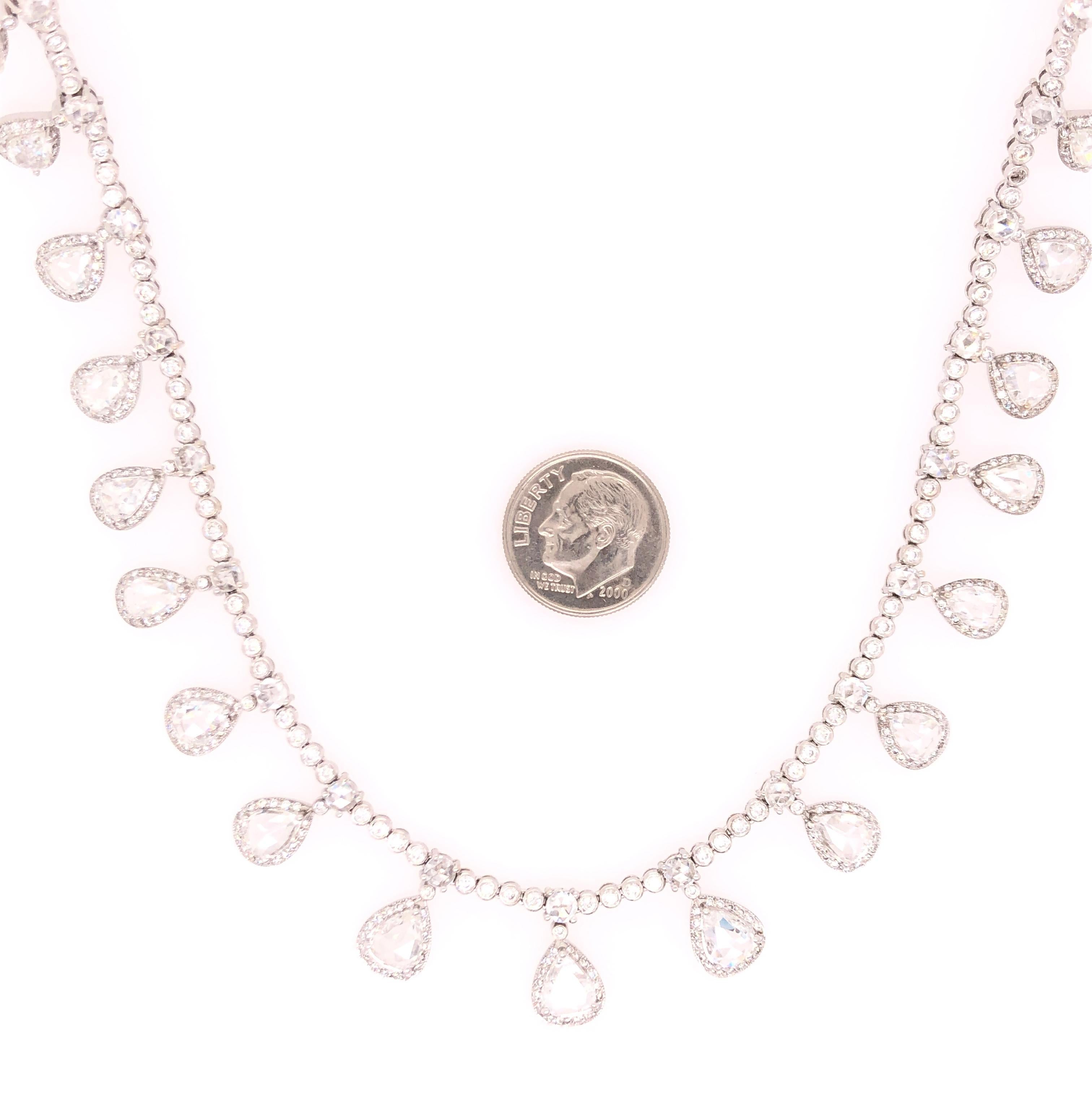 Elegant and sophisticated this lovely 18 karat white gold diamond necklace is sure to enchant all those that look upon it. 

An estimated 10 CTS of diamonds shine brilliantly from their settings. With the optional extender, the necklace is 18