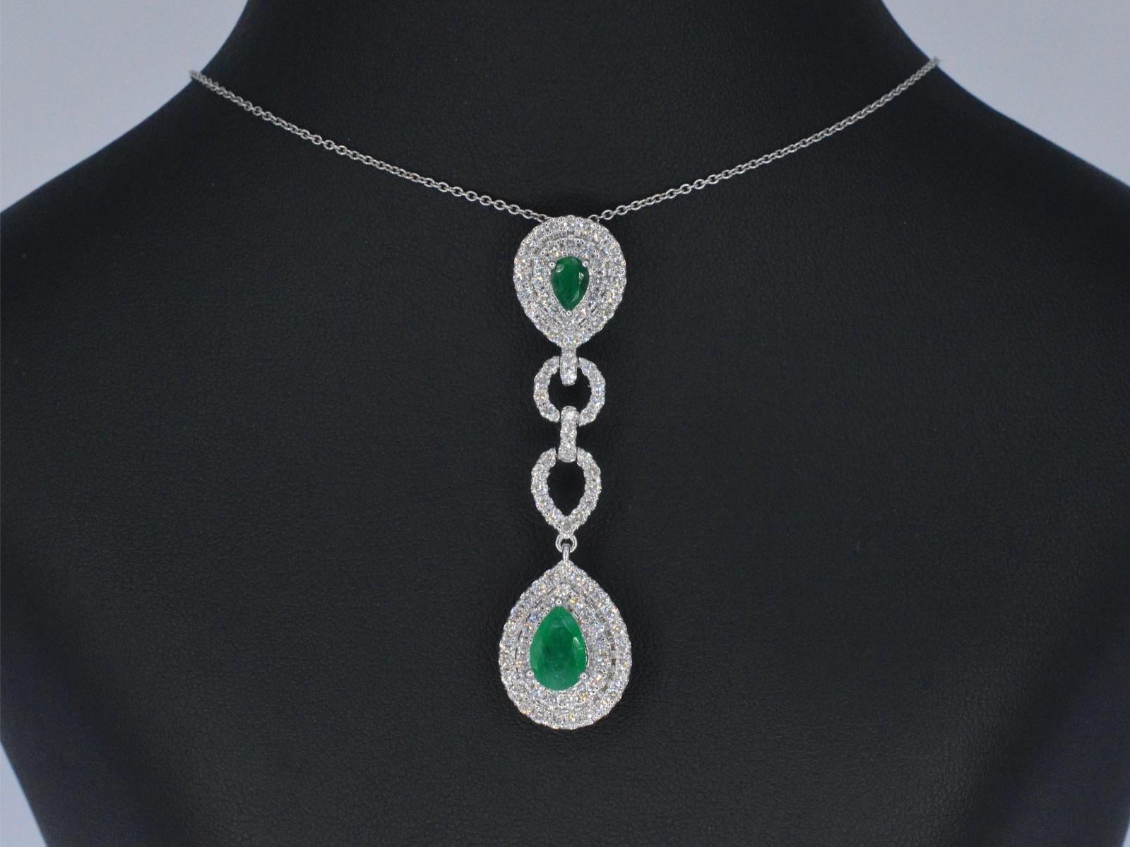 Contemporary White Gold Pendant Set with Diamonds and Emeralds For Sale