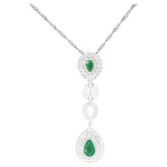 White Gold Pendant Set with Diamonds and Emeralds