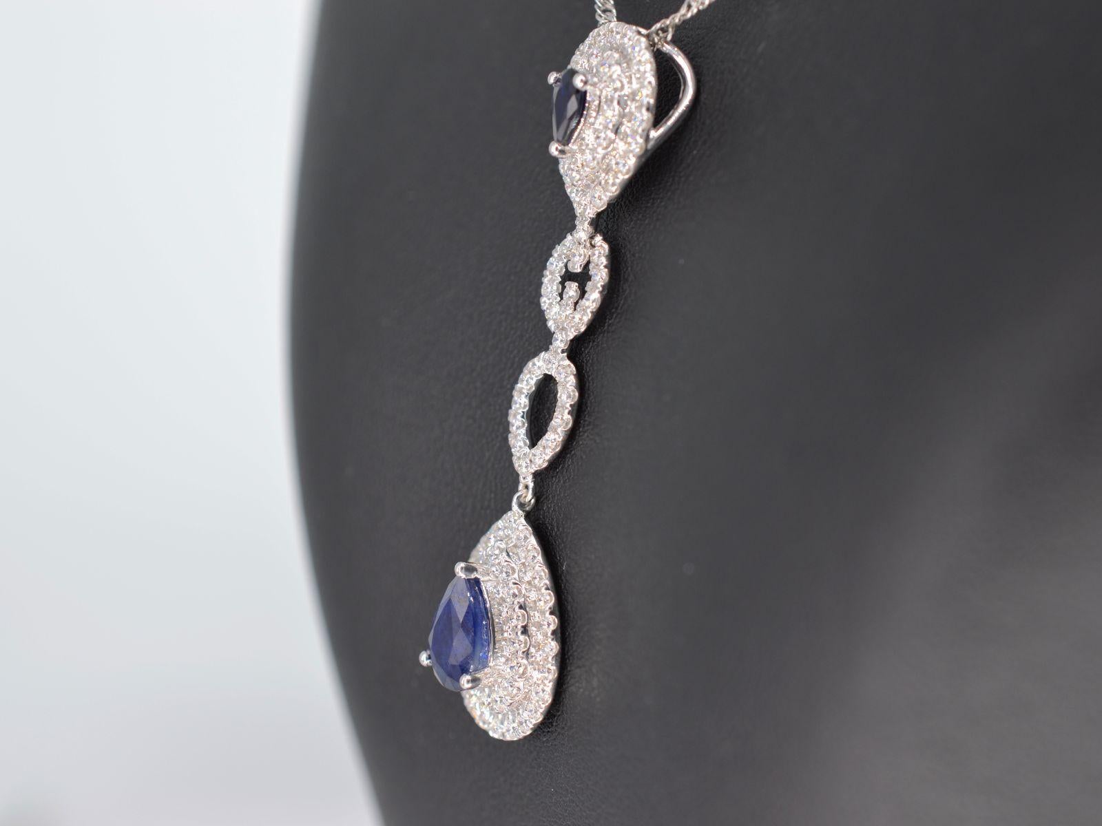 Contemporary White Gold Pendant Set with Diamonds and Sapphires For Sale