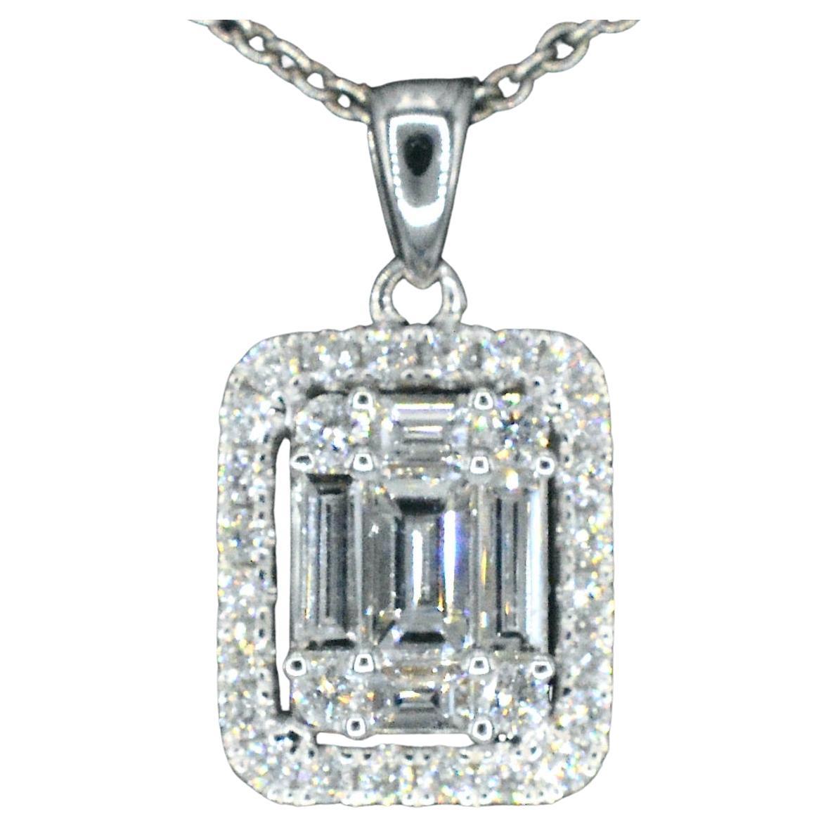 White gold pendant with diamonds and emerald shape in the middle