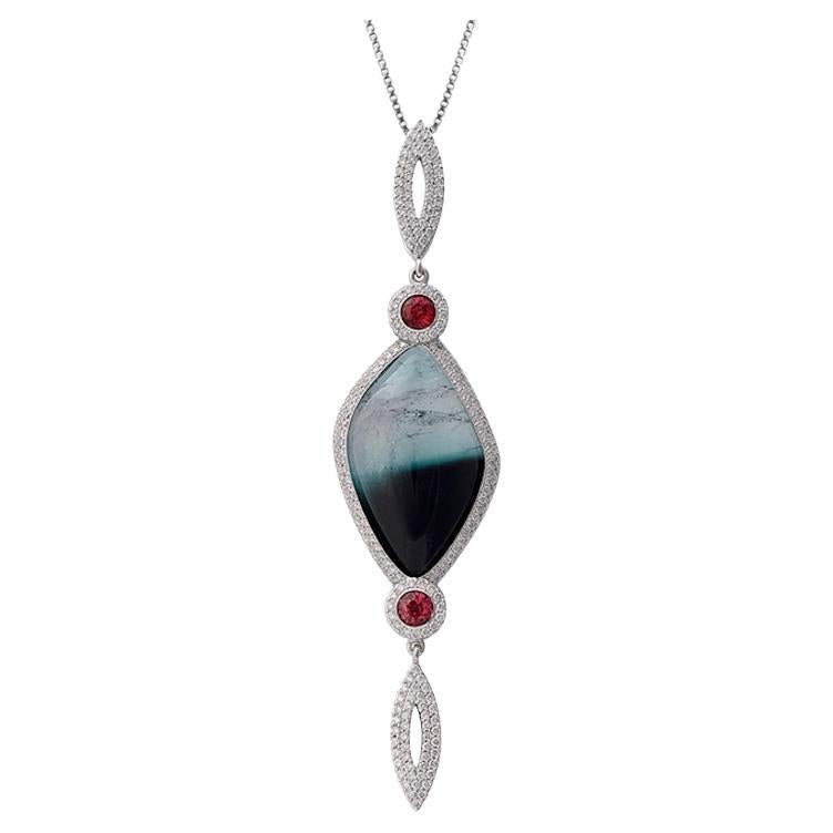 Ciondolo in oro bianco con diamante bianco, zaffiro rosso e tormalina cabochon