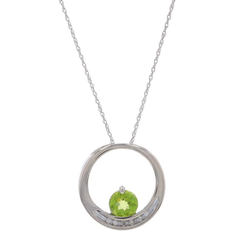 Metal Content: 10k White Gold

Stone Information
Natural Peridot
Carat(s): .85ct
Cut: Round
Color: Green

Natural Diamonds
Carat(s): .03ctw
Cut: Single
Color: H - I
Clarity: SI2 - I1

Total Carats: .88ctw

Chain Style: Prince of Wales
Necklace