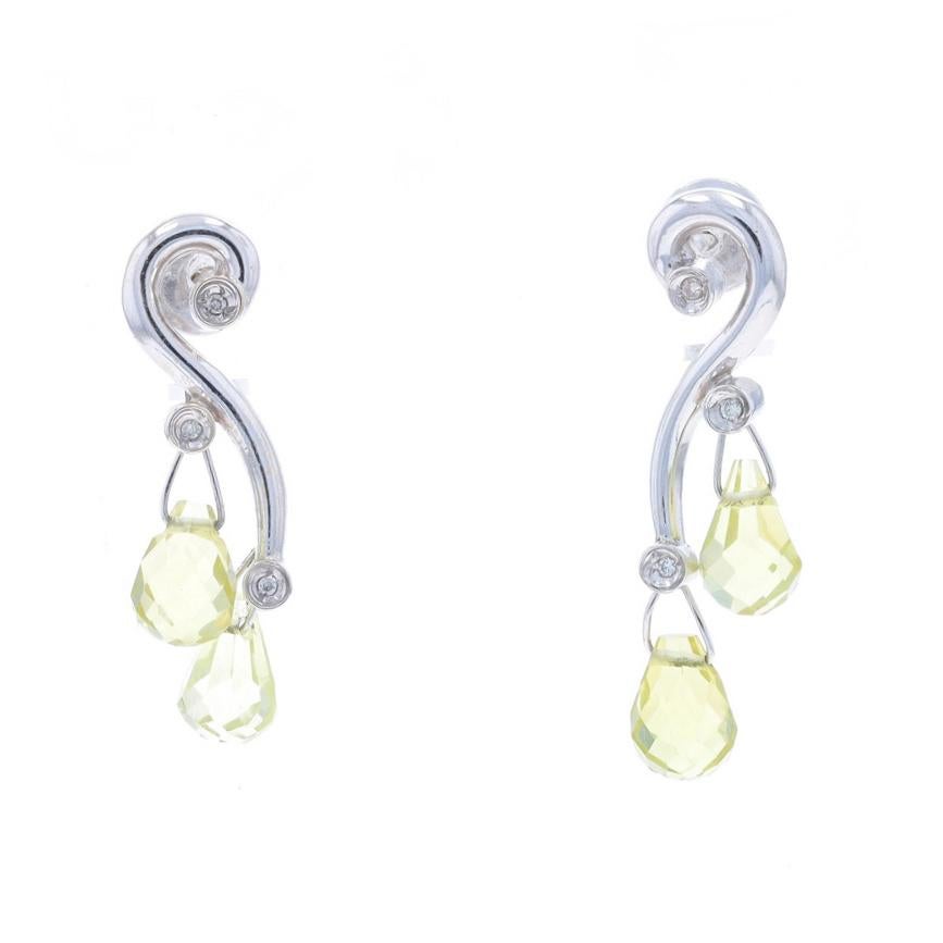 Metal Content: 18k White Gold

Stone Information

Natural Peridot
Cut: Briolette
Color: Light Yellowish Green

Natural Diamonds
Carat(s): .04ctw
Cut: Round Brilliant
Color: I - J
Clarity: SI1 - SI2

Style: Dangle
Fastening Type: Butterfly