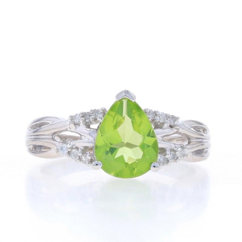 Size: 7 1/4
Sizing Fee: Up 2 sizes for $25 or Down 1 1/2 sizes for $25

Metal Content: 10k White Gold

Stone Information

Natural Peridot
Carat(s): 1.45ct
Cut: Pear
Color: Green

Natural Diamonds
Carat(s): .10ctw
Cut: Single
Color: G - H
Clarity: