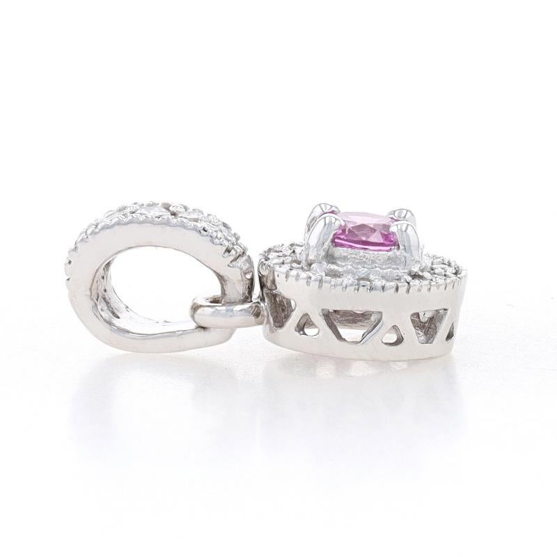 Metal Content: 14k White Gold

Stone Information
Natural Sapphire
Treatment: Heating
Carat(s): .60ct
Cut: Round
Color: Pink

Natural Diamonds
Carat(s): .32ctw
Cut: Round Brilliant
Color: H - I
Clarity: VS1 - VS2

Total Carats: .92ctw

Style:
