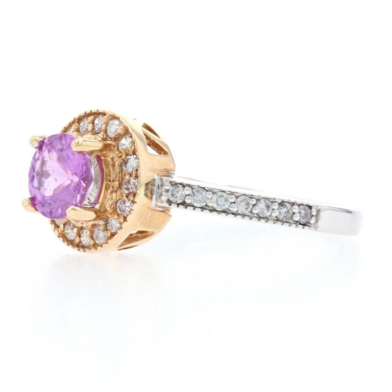 This beautiful two-toned ring would make a great birthday or anniversary gift or an elegant engagement ring for the bride who dreams of something unique. Fashioned in two types of 14k gold, this NEW piece features a pink sapphire solitaire in a