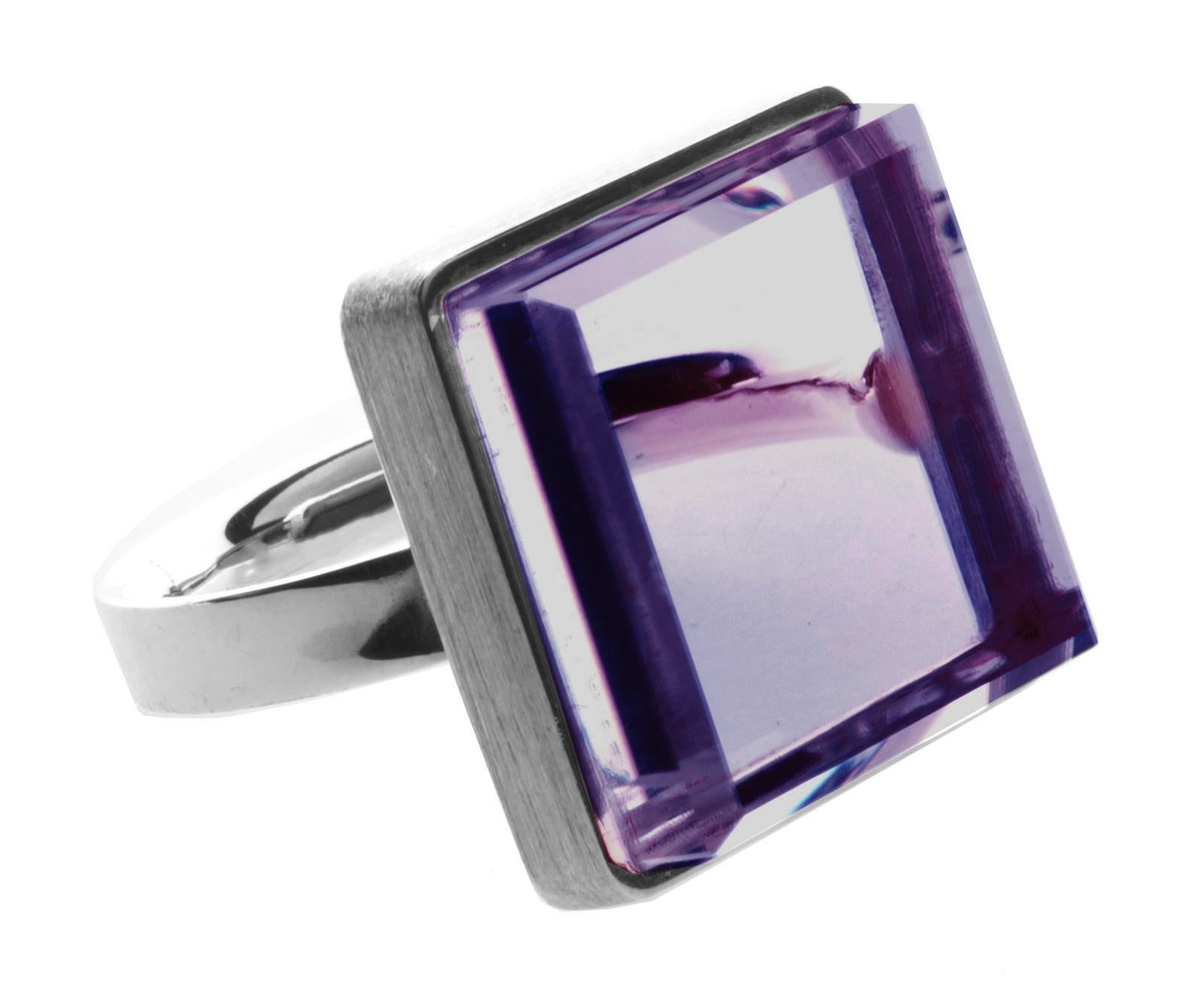 This Art Deco style ring features a natural amethyst in a sterling silver setting. It has been featured in Harper's Bazaar and Vogue UA, and its design reflects the Art Deco spirit, making it suitable for both men and women. This large ring is