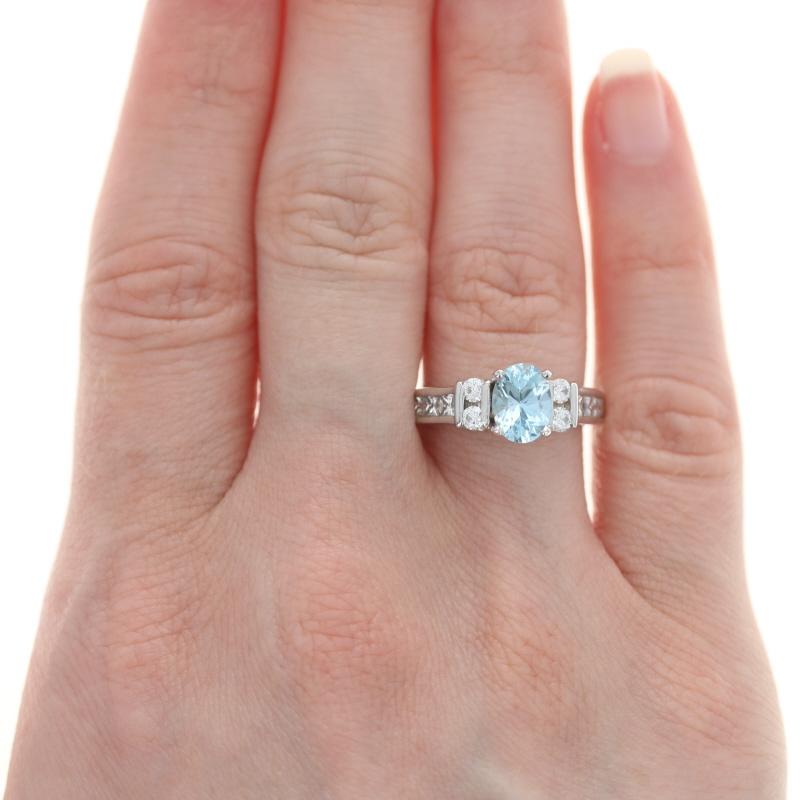 Size: 7
Sizing Fee: Up 1 size for $50 
(the sizing process will remove the stamps)

Metal Content: 18k White Gold (mounting) & Platinum (aquamarine's prongs)

Stone Information
Genuine Aquamarine
Treatment: Heating
Carat: 1.15ct
Cut: Oval
Color: