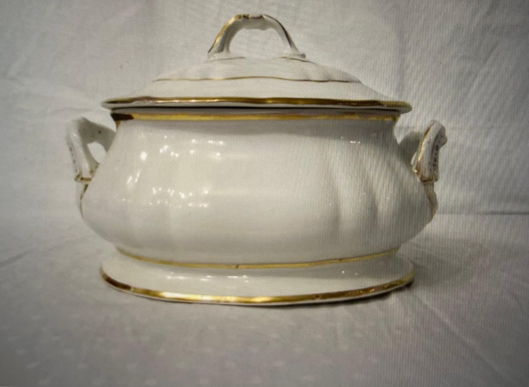 Brilliant white and gold porcelain soup tureen.