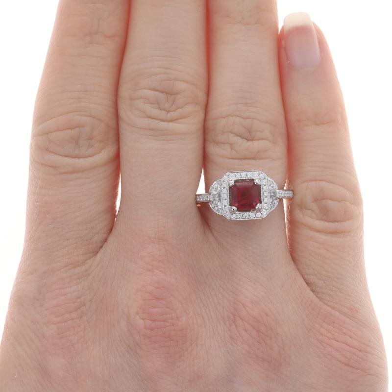 Size: 6 1/4

Metal Content: 14k White Gold

Stone Information
Natural Red Emerald Beryl
Carat(s): .64ct
Cut: Square Emerald
Color: Red
Certified by: GIA
Report Number: 6204533614

Natural Diamonds
Carat(s): .51ctw
Cut: Half Moon & Round