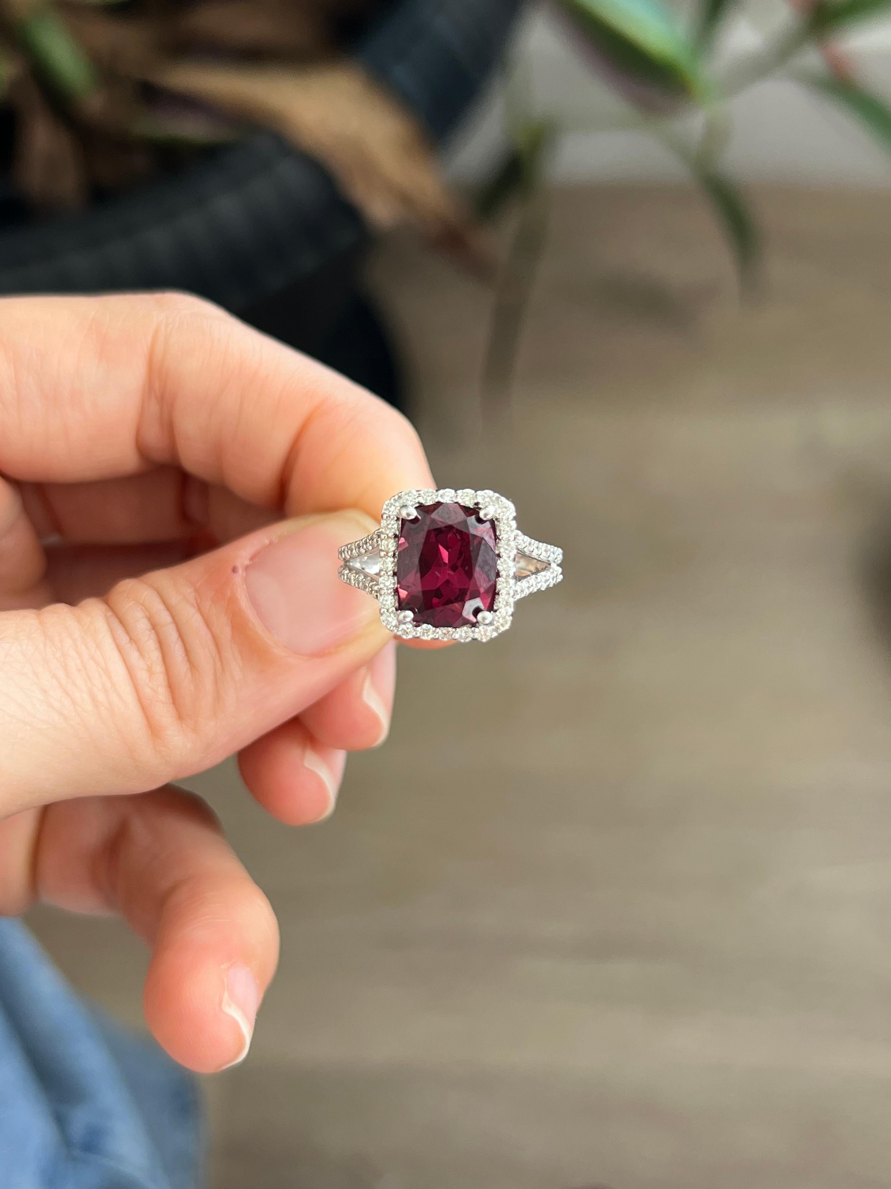 14K white gold and diamond ring with rhodolite garnet center stone.

Rhodolite garnets offer a brilliant and vibrantly colored combination of pink and purple hues that make them perfect for everyday wear. Their beauty and brilliance come from their