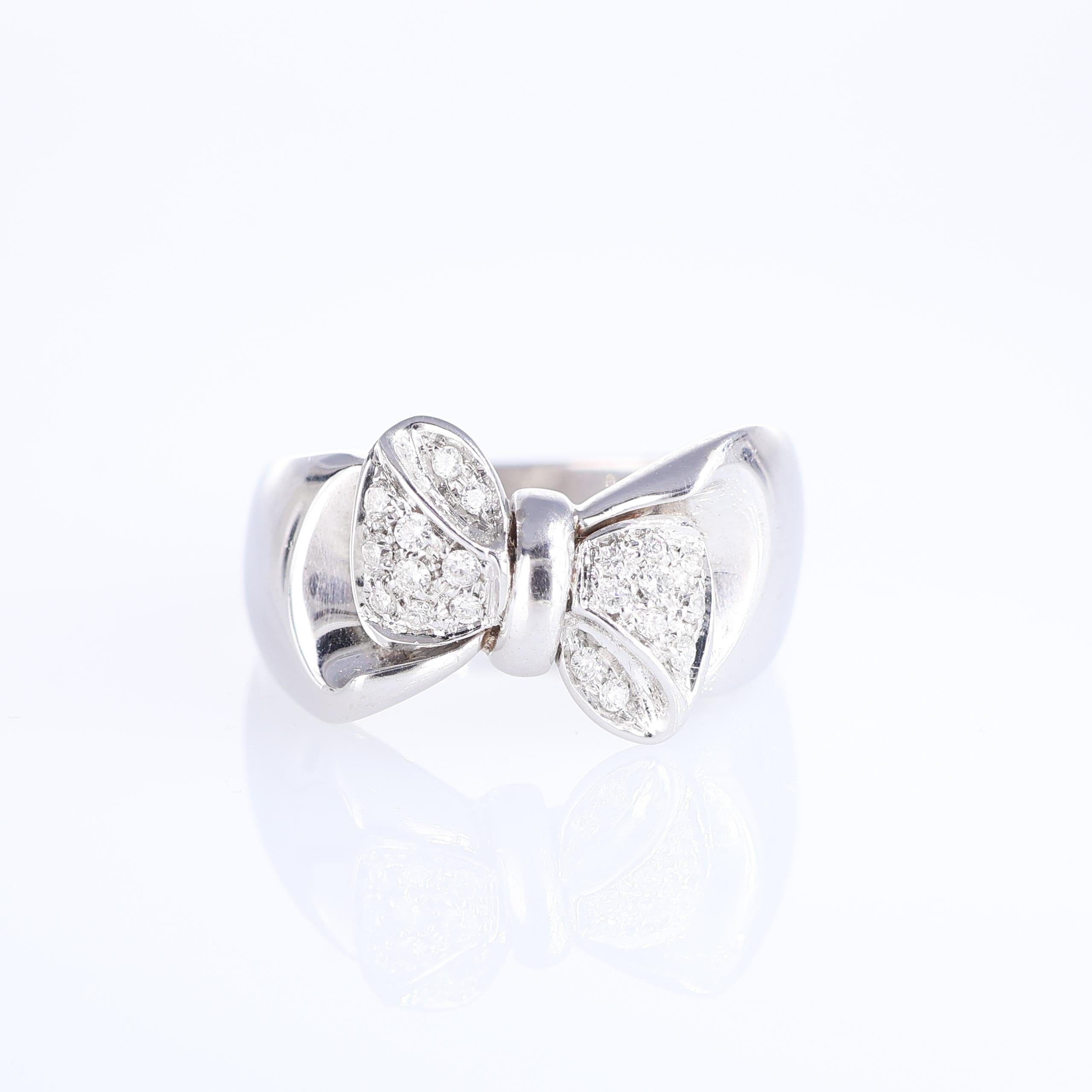 IMPORTANT NOTE:
✔ No additional costs will be added to this order.
✔ Shipping and customs duties are fully covered by us.
--------------------
This charming band ring, crafted in 18-karat white gold, showcases a delightful ribbon motif adorned with