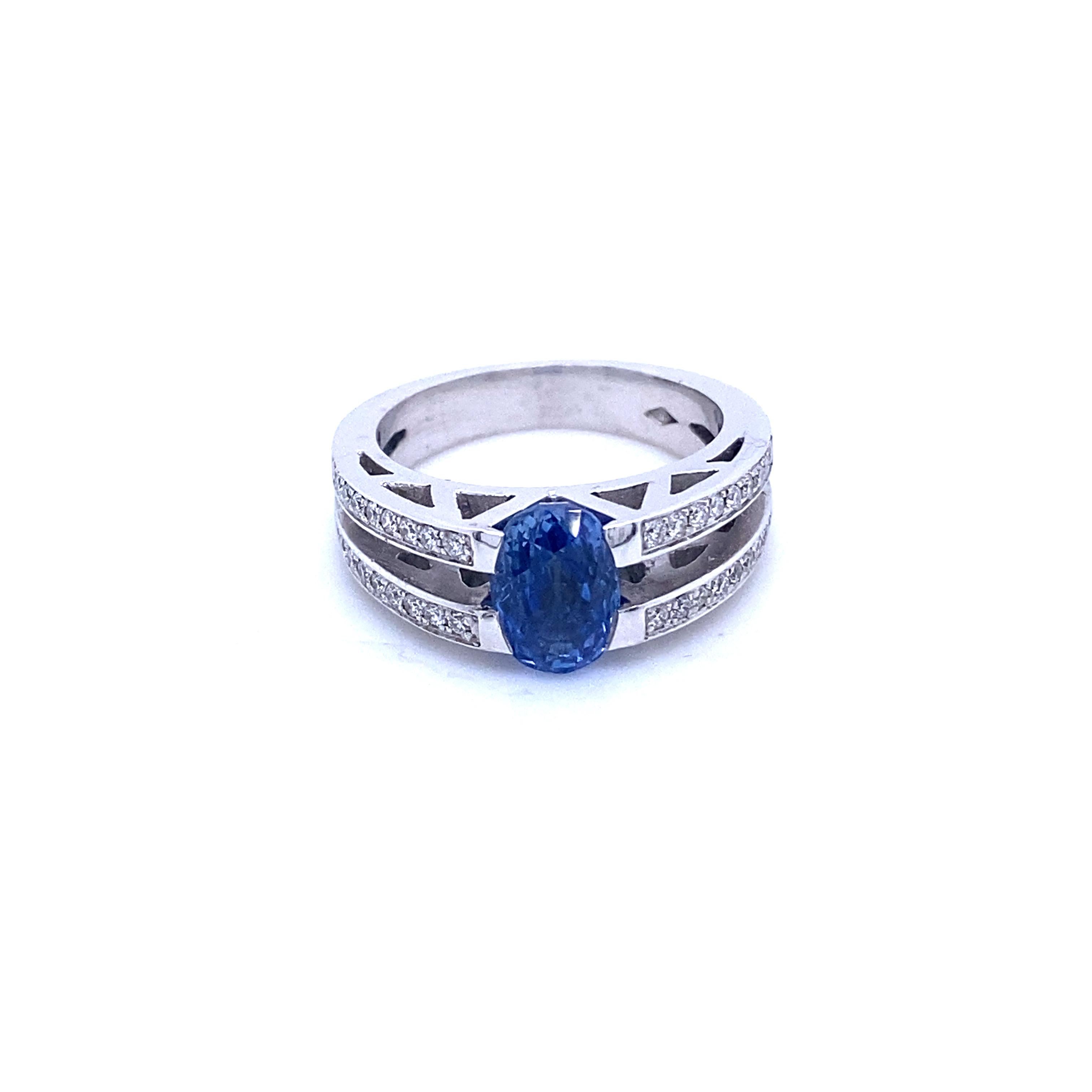 White Gold Ring 2.2 Carat Sapphire and 0.27 Carat Diamonds
French Collection by Mesure et Art du Temps. 

Magnificent 18 Carat white gold ring surmounted by a blue sapphire, oval shape, 2.2 Carats and accompanied by brilliant cut diamonds, 0.27