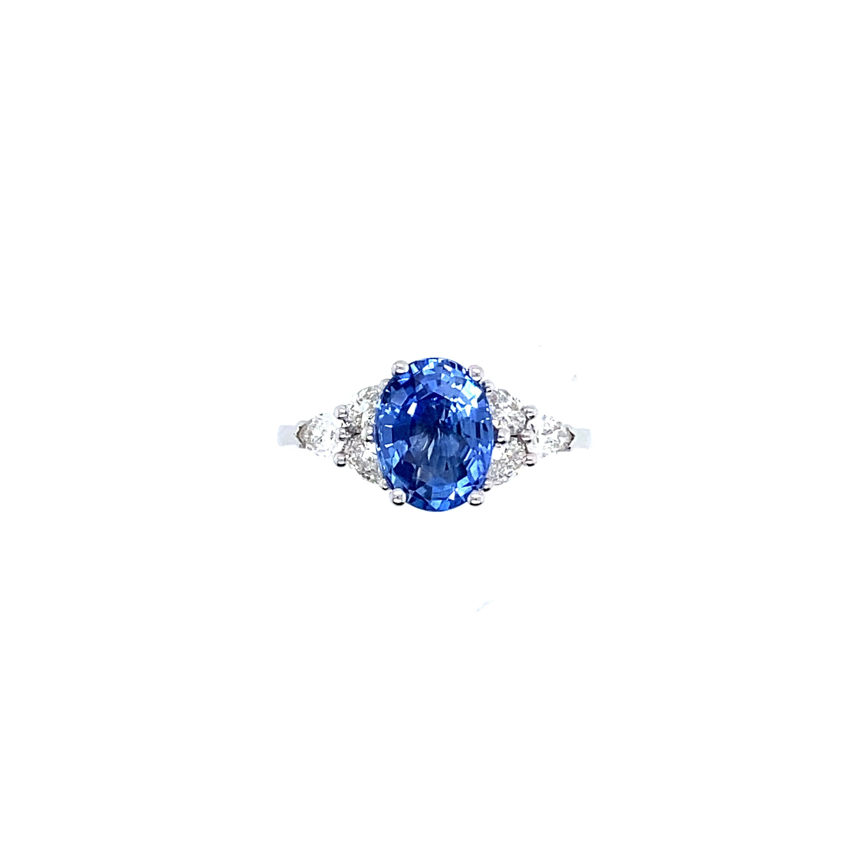 sapphire surrounded by diamonds ring
