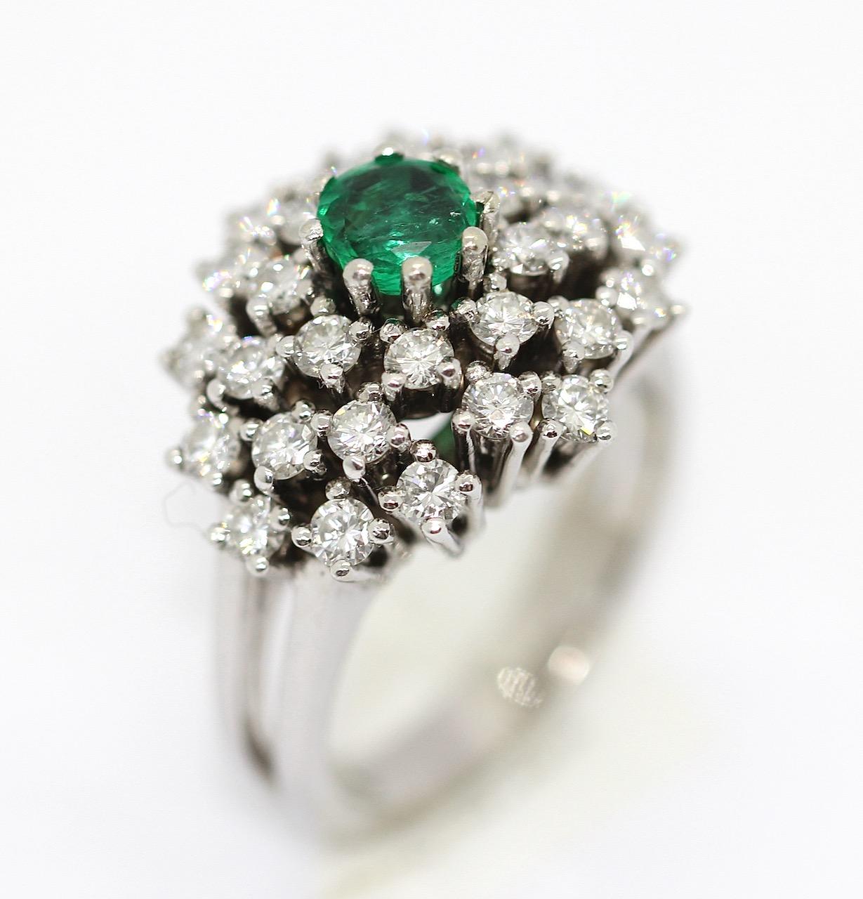 Charming white gold ring with diamonds and emerald. 14 Karat.

Ring is set with countless diamonds of very good quality and an emerald.
Very strong, natural shine of the diamonds.

Includes certificate of authenticity.