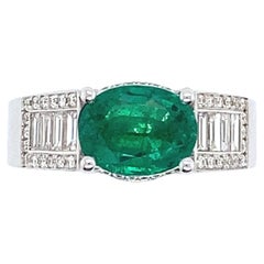 White Gold Ring Surmounted by an Natural Emerald with Diamonds