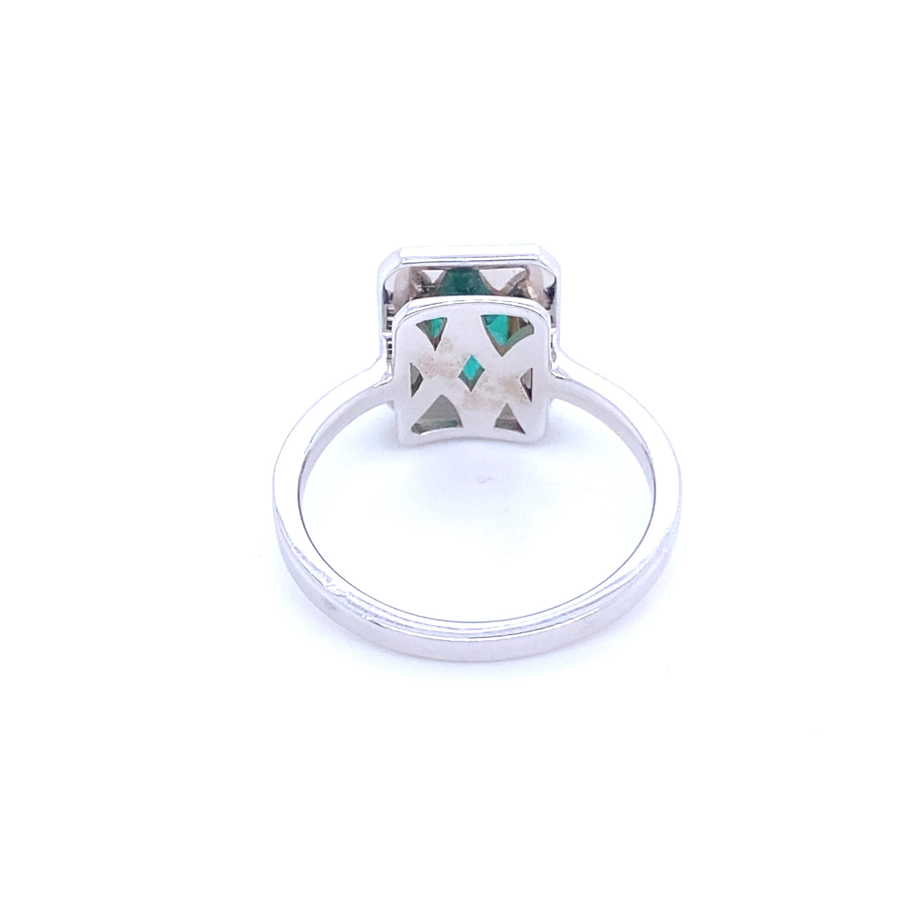 Emerald Cut Ring Surmounted by an RPC-Cut Emerald Surrounded by Diamonds White Gold 18 Karat For Sale