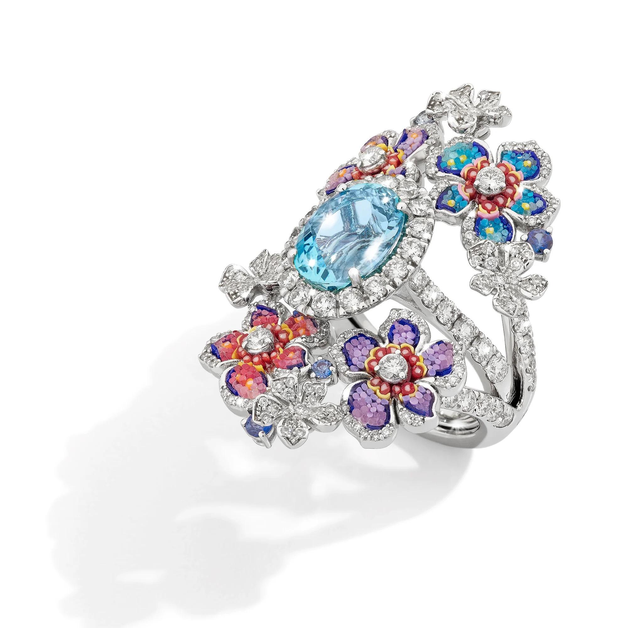 Introducing the vibrant Giardino Estate ring, a glorious tribute to a blooming summer garden.
The ring is filled with life through its various shades of vibrant micromosaic. 
Accompanying the mosaic artistry, white diamonds dance around the ring,