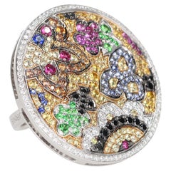 Anello in oro bianco con ciondolo floreale staccabile in pietre preziose