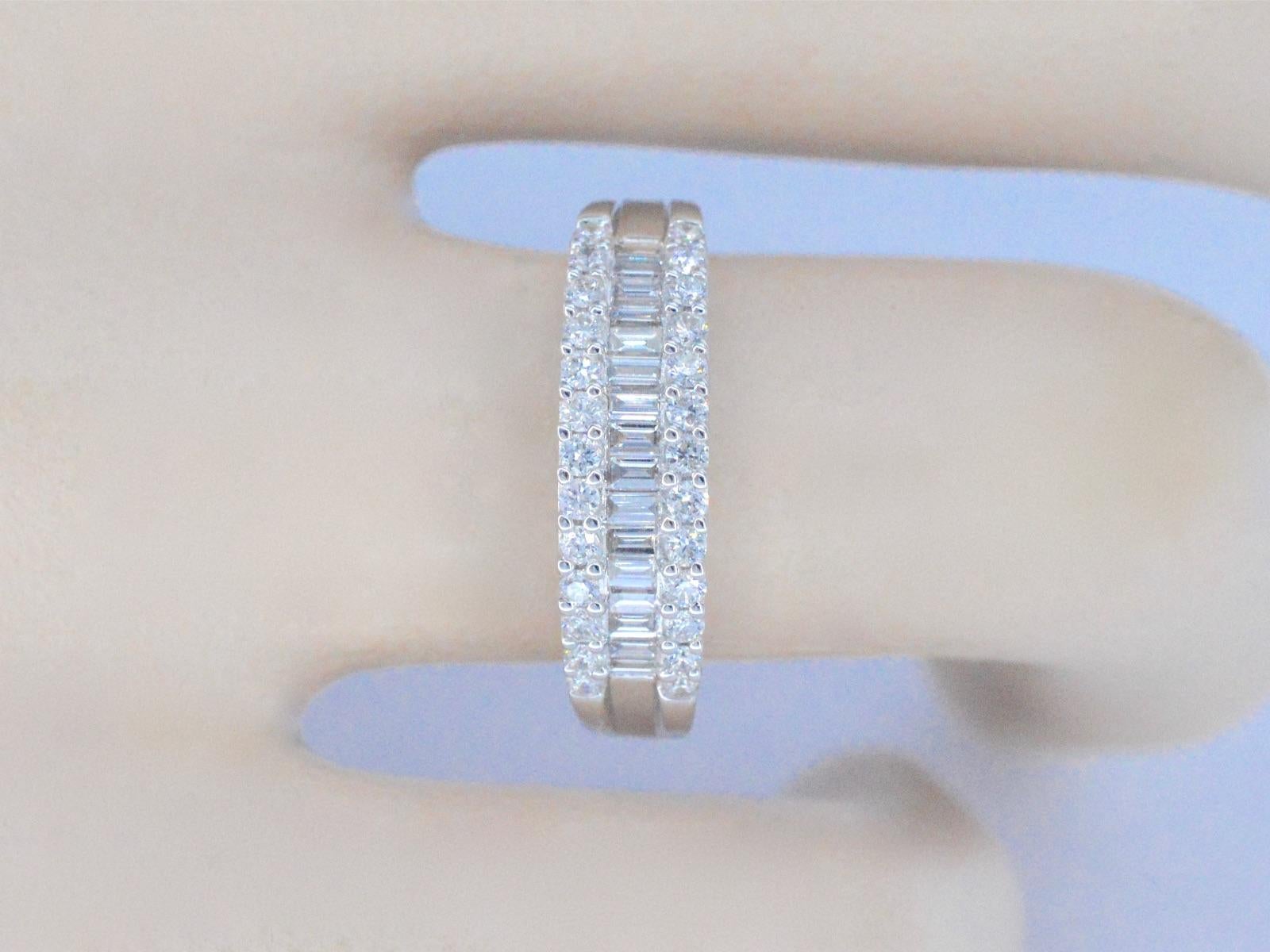 Diamonds: 42 pieces; Weight: 0.75 carat; Cut: Brilliant and baguette; Colour: F-G; Purity: VS; Grinding quality: Very good; Weight: 4.2 ounces; Ring Size: 53 ( 17mm ); Hallmark: 18 karat ( 750 ); Condition: New; The quality has been taken from the