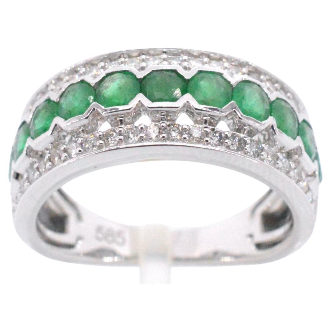 White Gold Ring with Diamonds and Emerald For Sale