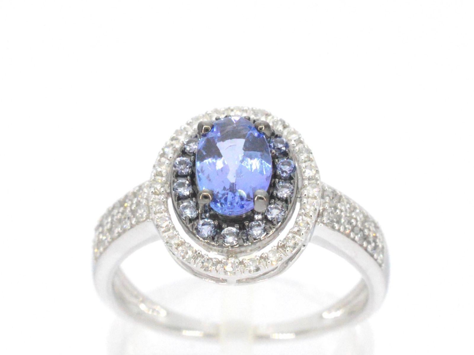 This elegant white gold ring features a stunning combination of diamonds and tanzanite gemstones. The diamonds are expertly set in a beautifully crafted white gold band, while the deep blue tanzanite gemstones add a pop of color and depth to the