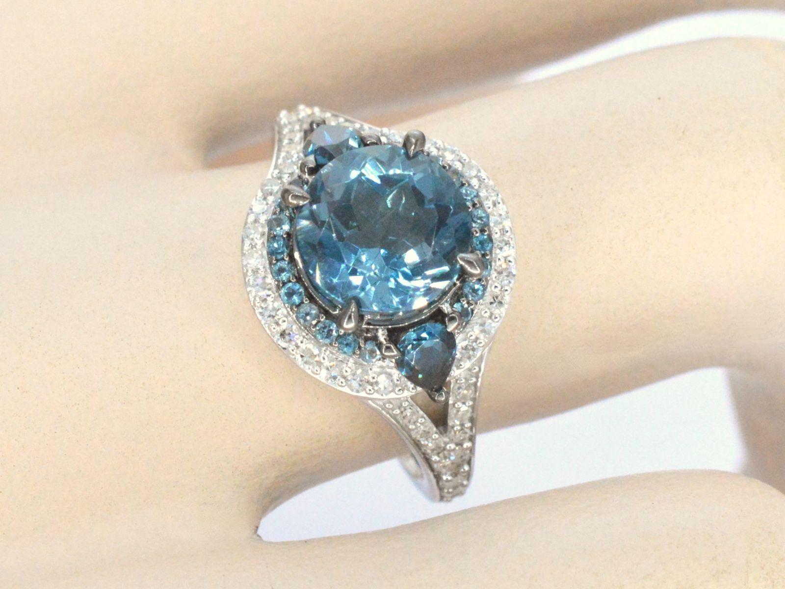 Contemporary White Gold Ring with Diamonds and Topaz For Sale