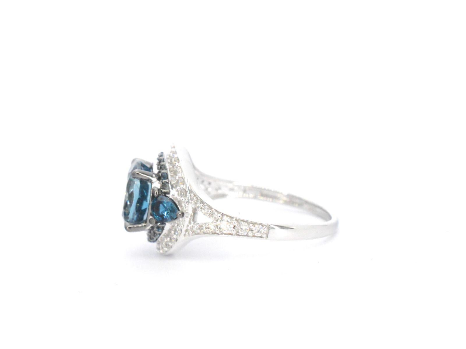 Brilliant Cut White Gold Ring with Diamonds and Topaz For Sale