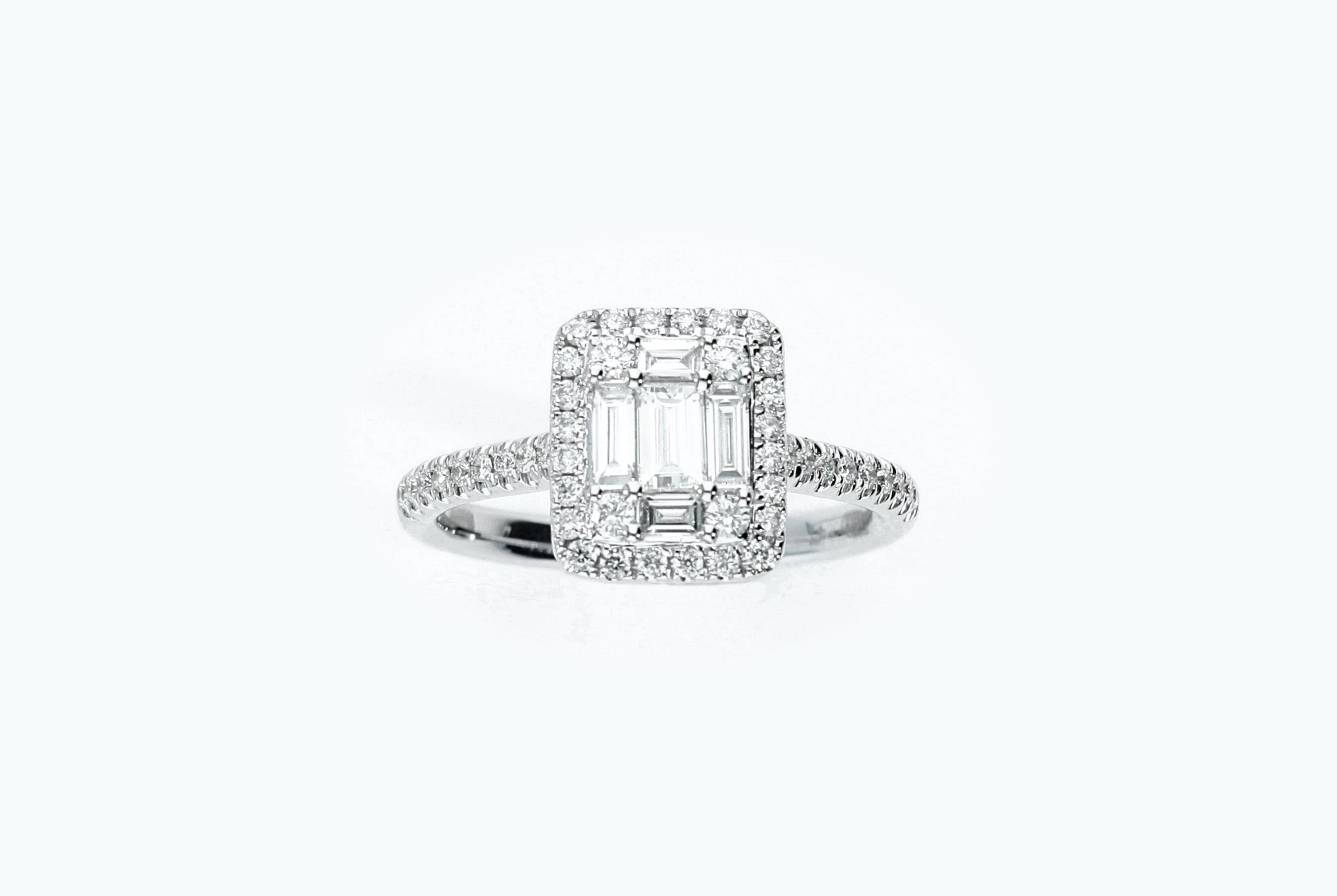 Ring with 5 baguette-cut diamonds and 46 brilliant-cut diamonds, for a total carat weight of 0.72 ct.
Contemporary ring in 18 Kt white gold.
The ring is made in Italy.

Total Diamonds Weight: ct. 0.72
Total Weight of 18 Kt Gold: 3.5 grams
Number of