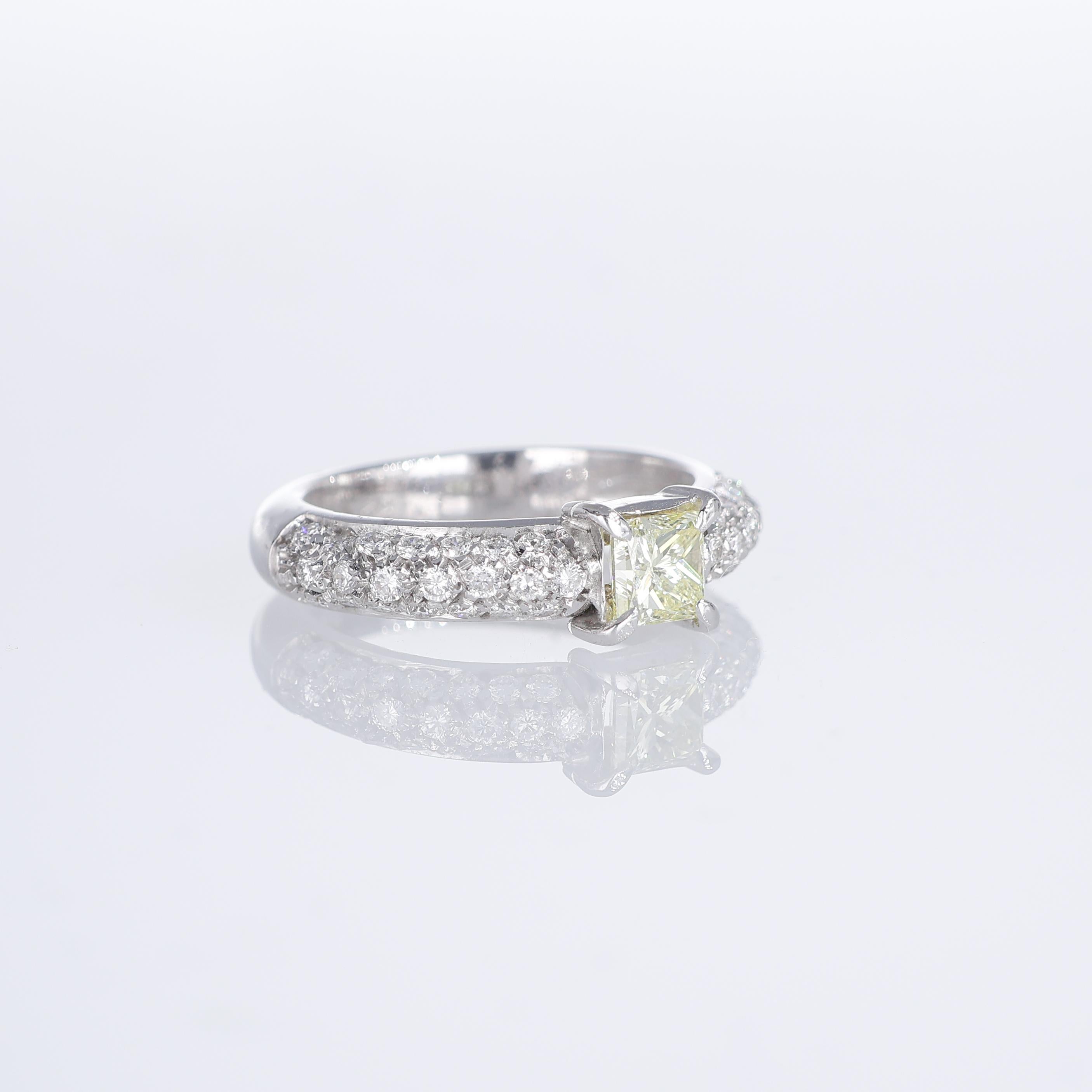 Brilliant Cut White Gold Ring with Fancy Yellow Princess Diamond and White Diamond Pavé For Sale