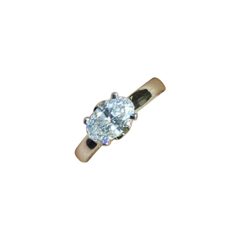White Gold Ring with GIA Certified 1.04 Carat Oval Diamond For Sale