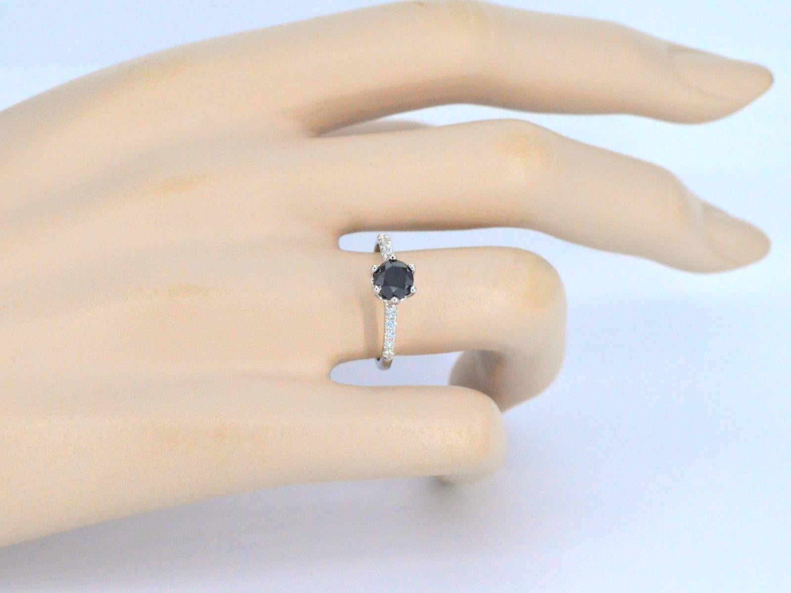 Contemporary White Gold Ring with One Brilliant Cut Black Diamond and White Diamonds For Sale