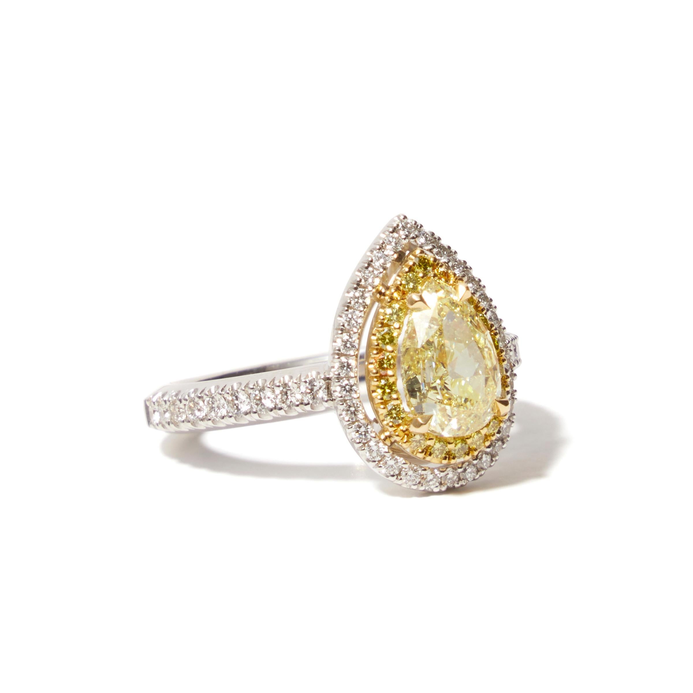 18 karat white gold ring set with a 1.51ct-fancy yellow pear-cut diamond

This ring with a 1.51 ct pear-cut fancy yellow diamond, surrounded by an entourage of white diamonds, is a unique creation from our workshop. Crafted in 18-carat white gold,